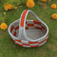 Rustic Harmony Handwoven Sabai Storage Basket Handwoven Sabai storage basket with terracotta and ivory checkered pattern