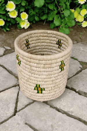 Handwoven Sabai utility basket with decorative natural woven pattern