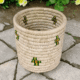 Handwoven Sabai utility basket with decorative natural woven pattern