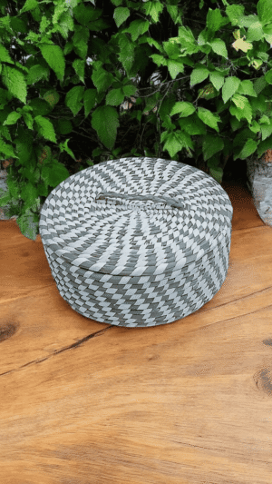 Handwoven Sabai grass storage basket with matching lid
