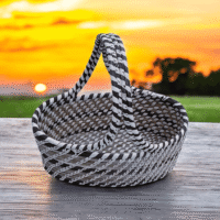Handwoven Sabai grass utility basket with black and white checkered woven design