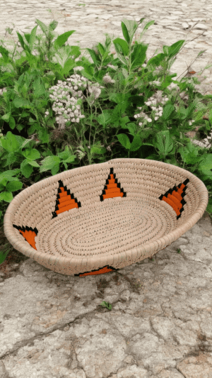 Handwoven Sabai grass serving tray with tribal triangle woven design