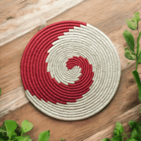 Crimson Spiral Sabai Grass Placemat with red and white handcrafted woven pattern