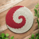 Crimson Spiral Sabai Grass Placemat Crimson Spiral Sabai Grass Placemat with red and white handcrafted woven pattern
