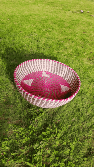 Handwoven Sabai Grass Decorative Tray – Pink Spiral Design Handwoven Sabai grass decorative tray with pink spiral woven design