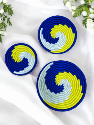 Sabai grass wall decor plate set with blue yellow and white spiral woven design