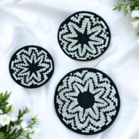 Handcrafted black and white Sabai grass wall decor plates with tribal design