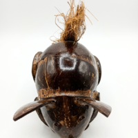 Handcrafted coconut shell turtle figurine with rustic artisan finish