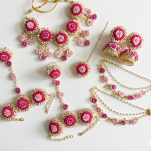 handcrafted pink floral cowrie shell jewelry set with necklace earrings for haldi mehendi bridal look