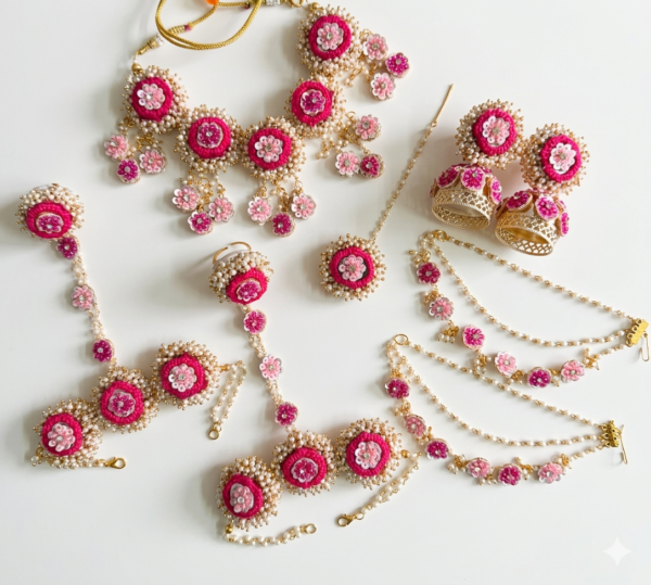 handcrafted pink floral cowrie shell jewelry set with necklace earrings for haldi mehendi bridal look