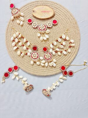 handcrafted floral cowrie shell jewelry set with necklace earrings for haldi mehendi bridal look