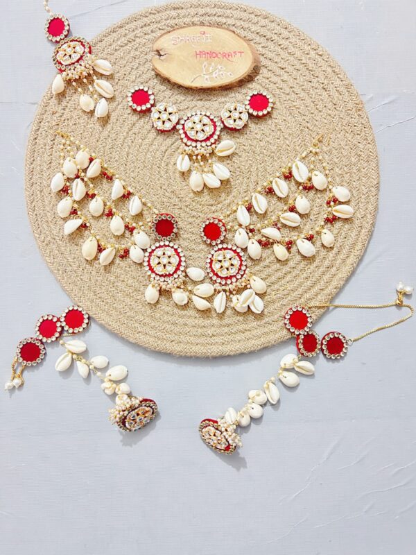 handcrafted floral cowrie shell jewelry set with necklace earrings for haldi mehendi bridal look