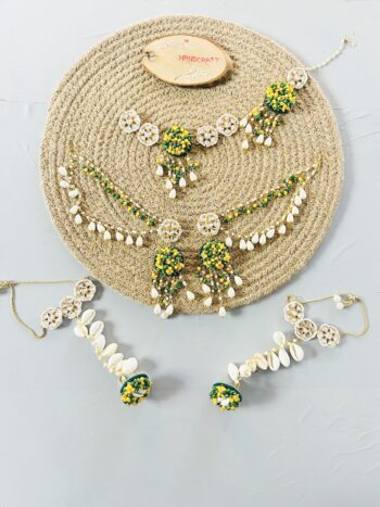 Floral Cowrie Shell Jewelry Set with Green Stones handcrafted floral cowrie shell jewelry set with green stones necklace earrings for haldi mehendi bridal look