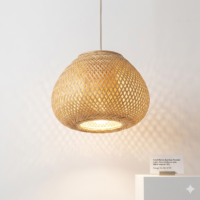 Handwoven natural cane pendant lamp with rounded woven design and warm ambient lighting
