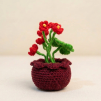 Ruby Bloom Handmade Crochet Flower Pot Handmade crochet red flower pot decor with green stems and brown crochet pot
