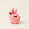 Handmade blush pink crochet bunny plush with mini bow detail