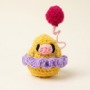 Sunny Puff Handmade Crochet Chick Plush Handmade yellow crochet chick plush with lavender ruffle collar and balloon detail