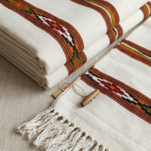 Handwoven white cotton scarf with tribal woven border and tassels