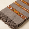Grey handwoven cotton scarf with tribal woven stripes and tassels