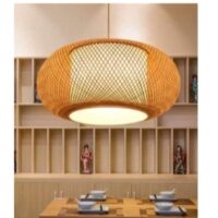 Handwoven cane pendant lamp with circular woven design and warm ambient lighting