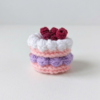 Berry Bliss Handmade Crochet Cake Charm Handmade crochet mini cake charm with lavender frosting and berry toppings