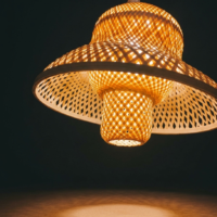 Handwoven lotus bloom cane pendant lamp with layered natural cane design and warm ambient lighting