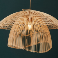 Handwoven bloom dome cane pendant lamp with layered natural cane design and warm ambient lighting