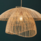 Handwoven bloom dome cane pendant lamp with layered natural cane design and warm ambient lighting
