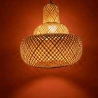 Handwoven royal lantern cane pendant lamp with layered woven design and warm ambient lighting