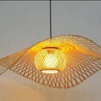 Handwoven wing-shaped cane pendant lamp with artistic open weave design and warm ambient lighting